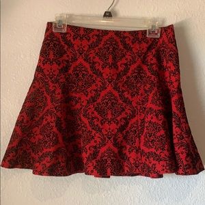 Red mini skirt with black brocade pattern